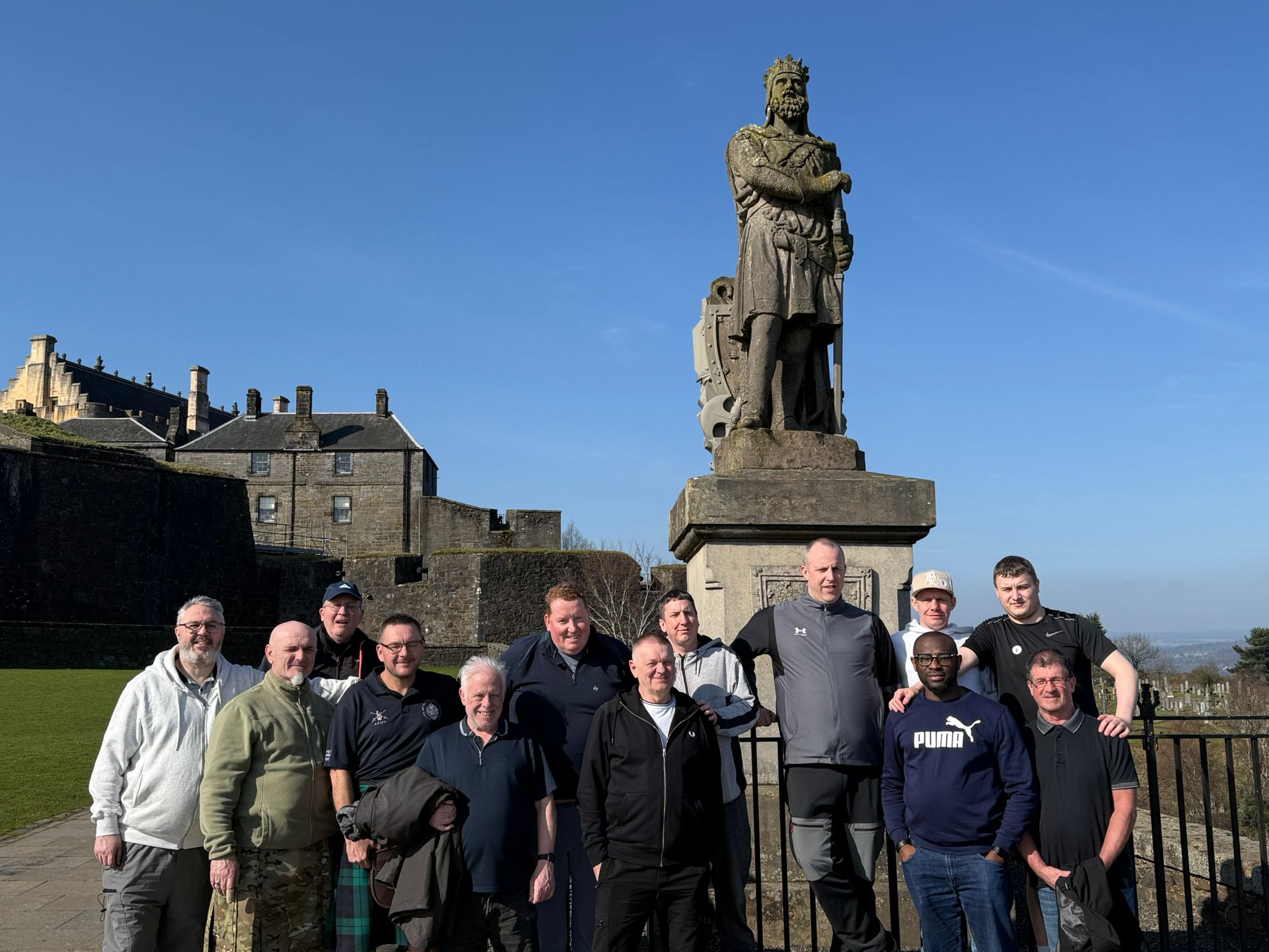 Tour group at Stirling Castle with Robert the Bruce statue